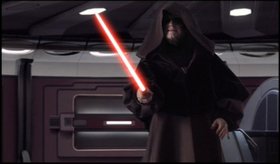Darth Sidious ignites his red lightsaber.